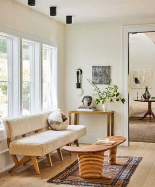 kitchen bench with wooden coffee table white walls